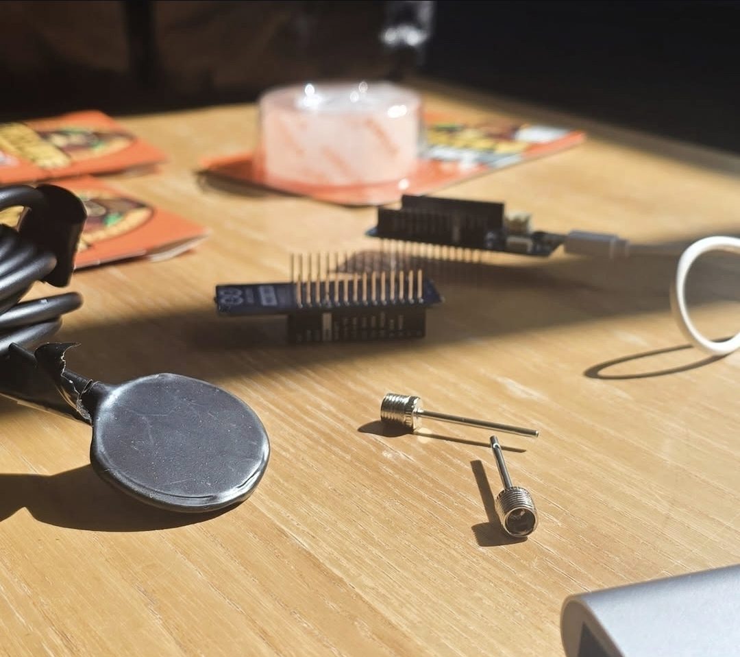 Electronics and contact-mic components on a table